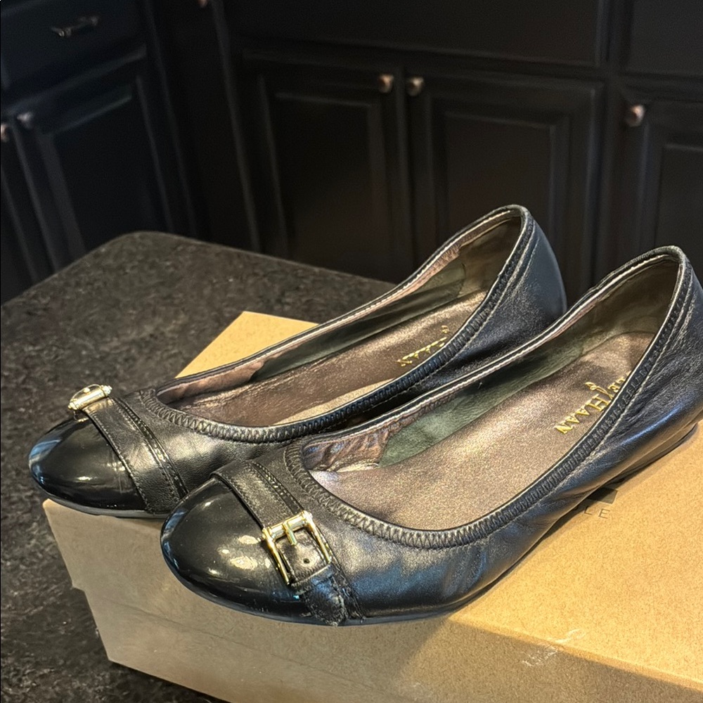 Cole Haan Black Leather Flats with Gold Buckle
Nike air cushion bottoms